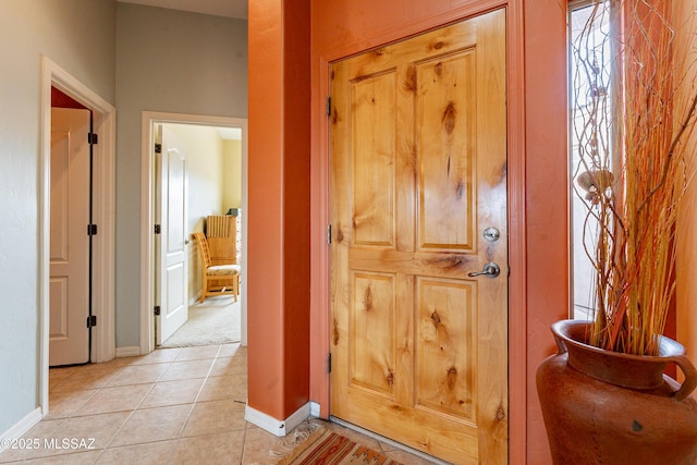 hallway featuring light tile patterned flooring