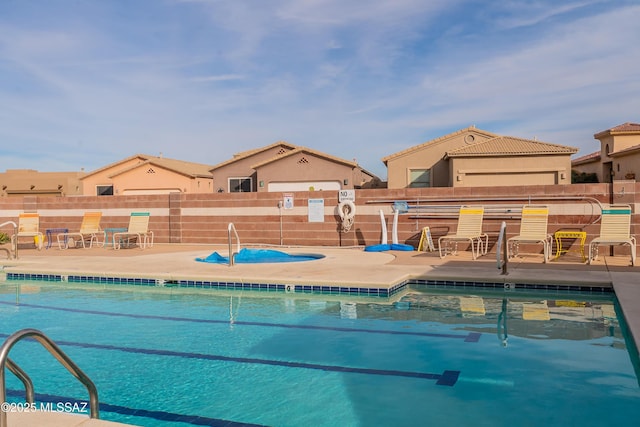 view of swimming pool featuring a bar