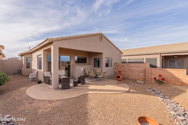 back of house featuring a patio