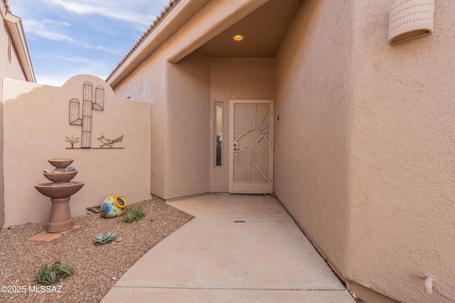 doorway to property featuring a patio