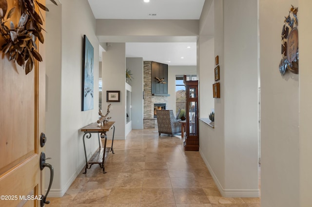 entryway with a stone fireplace