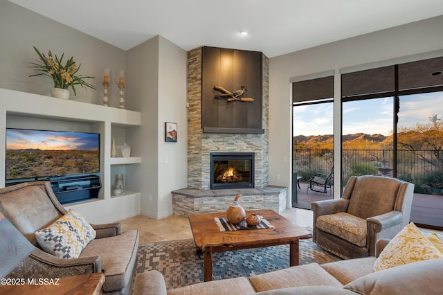 living room with built in shelves and a fireplace