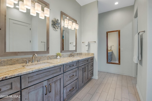 bathroom featuring vanity and hardwood / wood-style floors