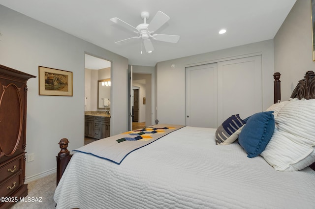 bedroom with carpet floors, a closet, ceiling fan, and ensuite bathroom