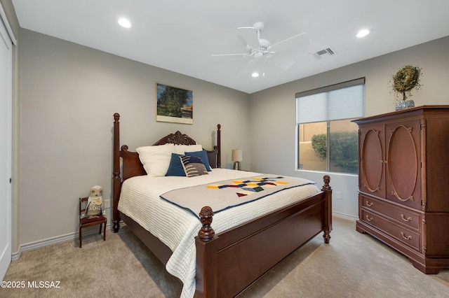 bedroom featuring light carpet and ceiling fan