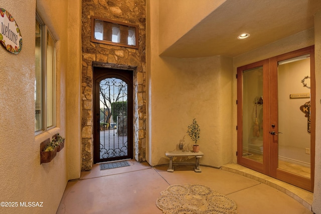 property entrance featuring french doors