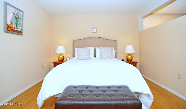 bedroom with light wood-type flooring