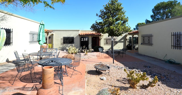 view of patio / terrace with a fire pit