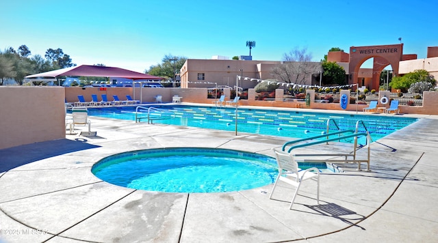 view of swimming pool with a patio