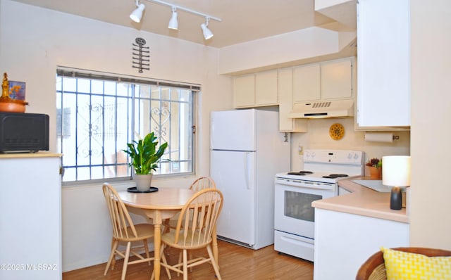 kitchen with white cabinetry, light hardwood / wood-style floors, and white appliances