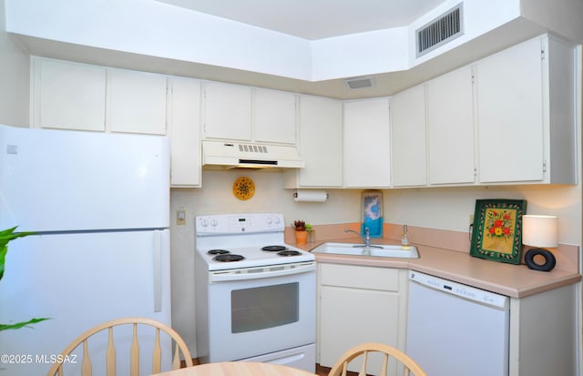 kitchen featuring white cabinets, white appliances, and sink