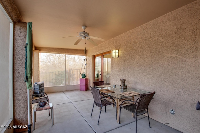 view of patio featuring ceiling fan