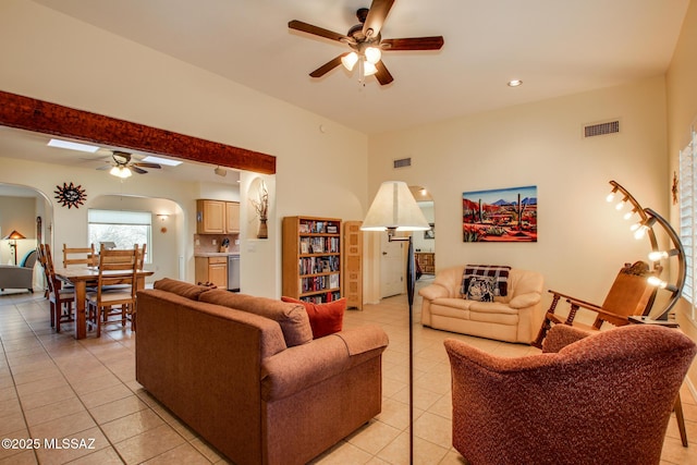 tiled living room featuring ceiling fan