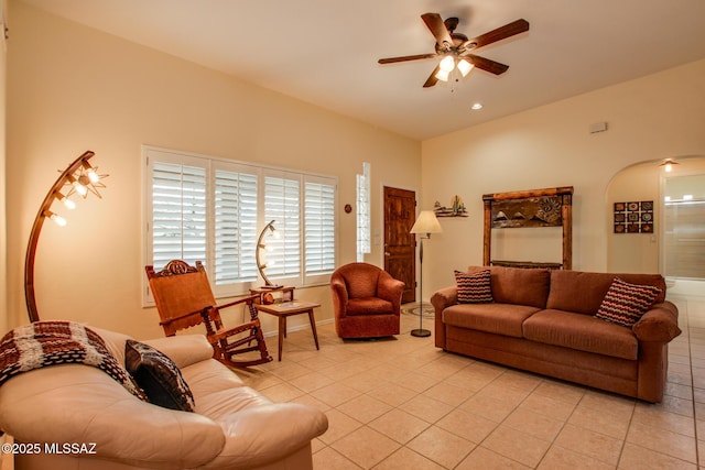 living room featuring light tile patterned flooring and ceiling fan