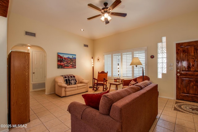 tiled living room featuring ceiling fan