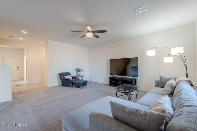 living room featuring ceiling fan and light colored carpet