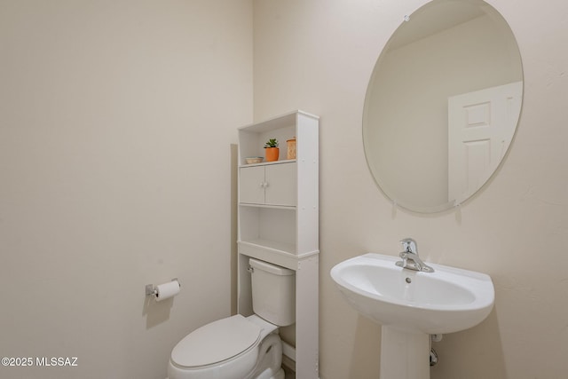 bathroom with sink and toilet