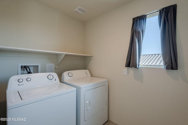 laundry area with washing machine and clothes dryer