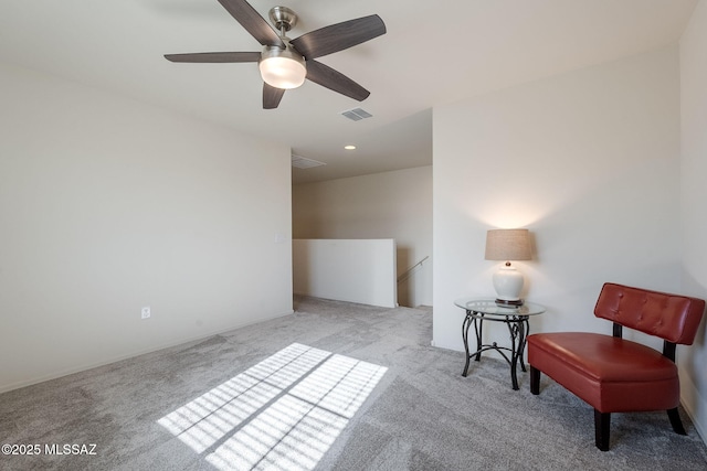 living area with light colored carpet