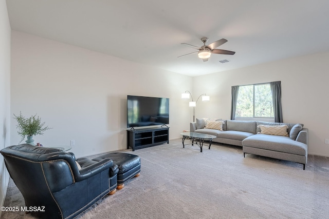 living room with ceiling fan and light carpet