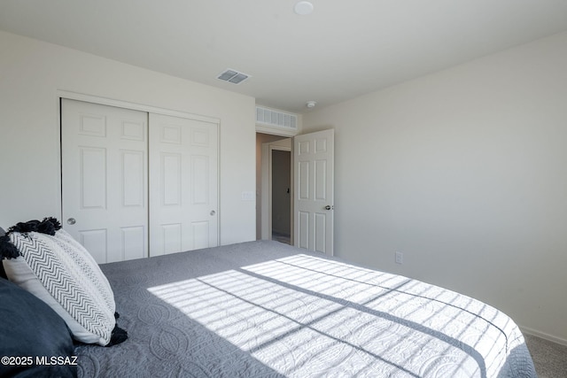 carpeted bedroom with a closet