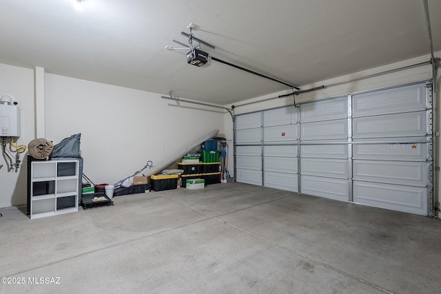 garage with tankless water heater and a garage door opener