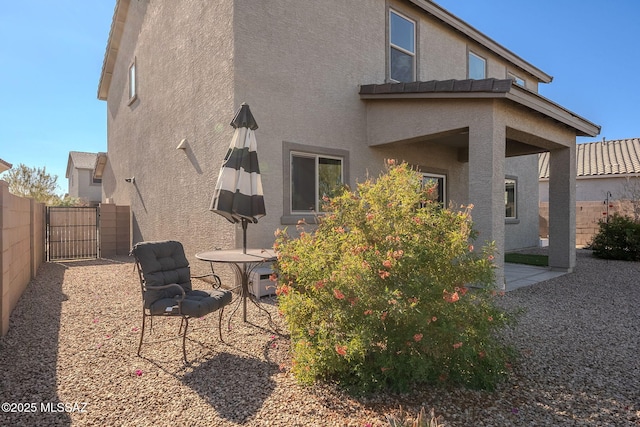 rear view of house featuring a patio area