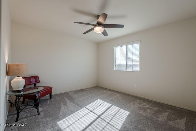 sitting room featuring ceiling fan and carpet flooring