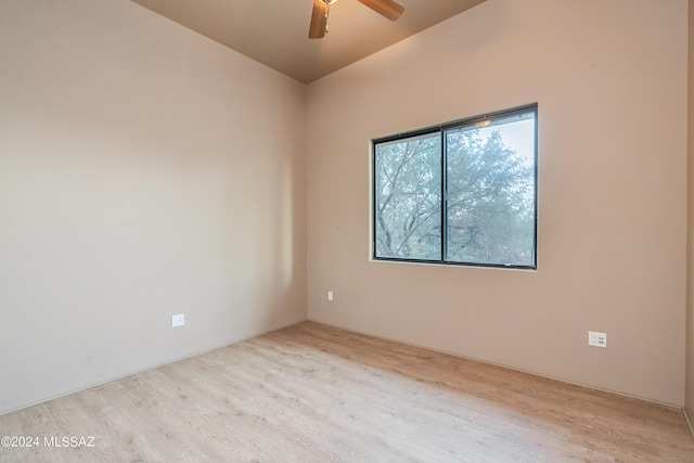 empty room featuring ceiling fan and light hardwood / wood-style flooring