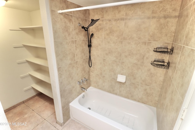 bathroom featuring tiled shower / bath combo and tile patterned floors