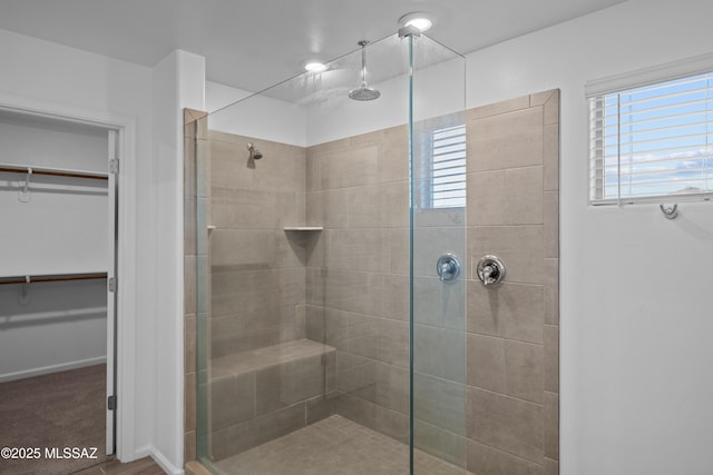 bathroom featuring tiled shower