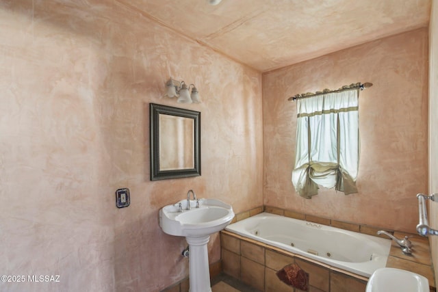 bathroom featuring tiled bath