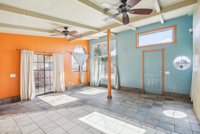 foyer entrance with ceiling fan and beam ceiling