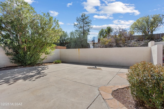 view of patio featuring fence