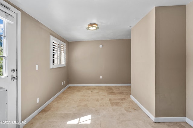 empty room with baseboards