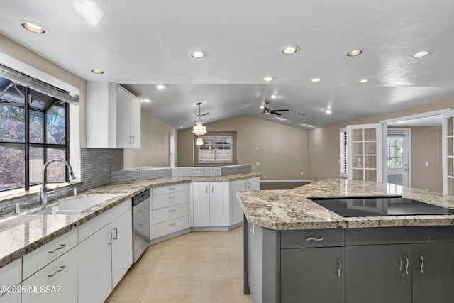 kitchen featuring a sink, white cabinets, black electric cooktop, and dishwasher