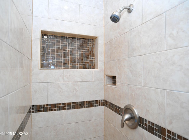 bathroom with a tile shower