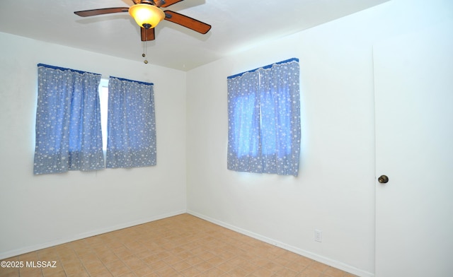 unfurnished room featuring ceiling fan