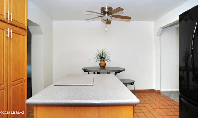 dining space featuring ceiling fan