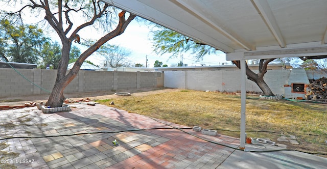 view of patio featuring exterior fireplace