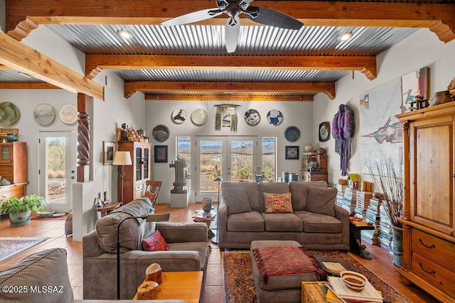 living room featuring french doors, ceiling fan, light tile patterned flooring, and beamed ceiling