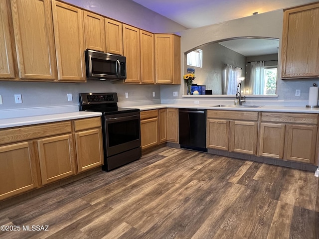 living room featuring sink, a notable chandelier, and dark hardwood / wood-style flooring