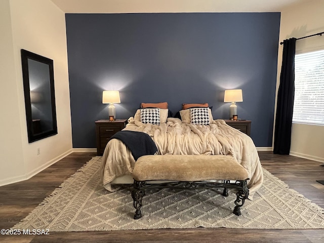 bedroom featuring dark wood-type flooring