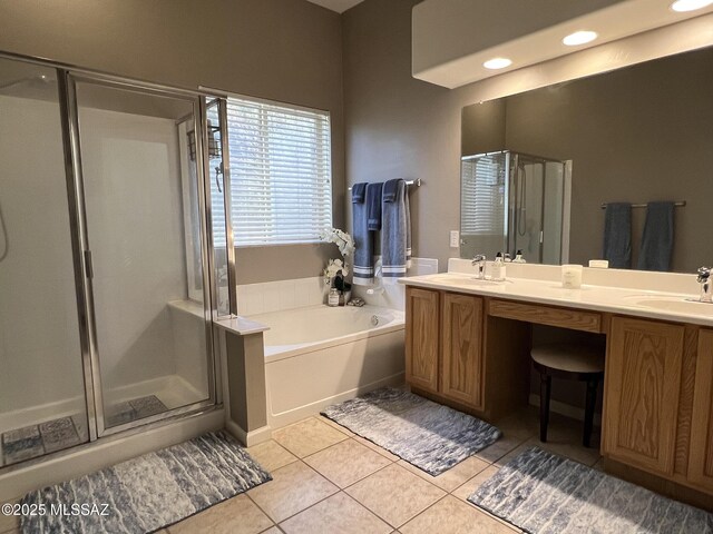 bathroom featuring vanity, plus walk in shower, and tile patterned flooring