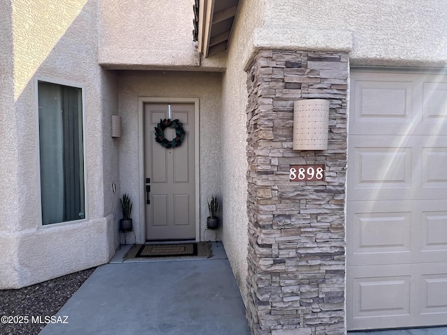 property entrance with a garage