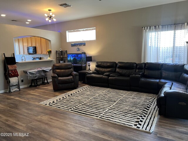 kitchen with dark wood-type flooring, appliances with stainless steel finishes, and sink