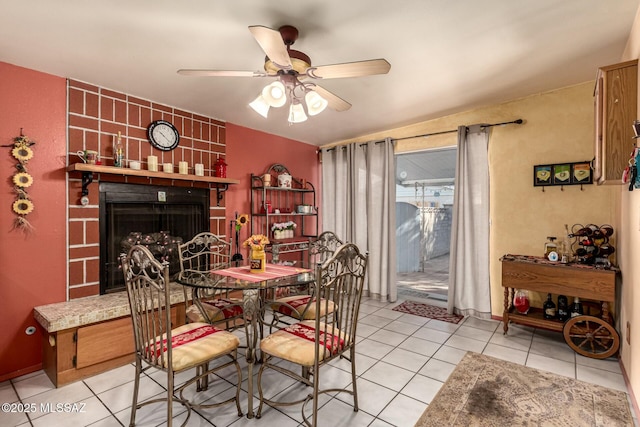 tiled dining space with ceiling fan