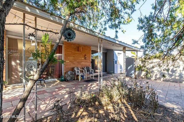 rear view of property with a patio area