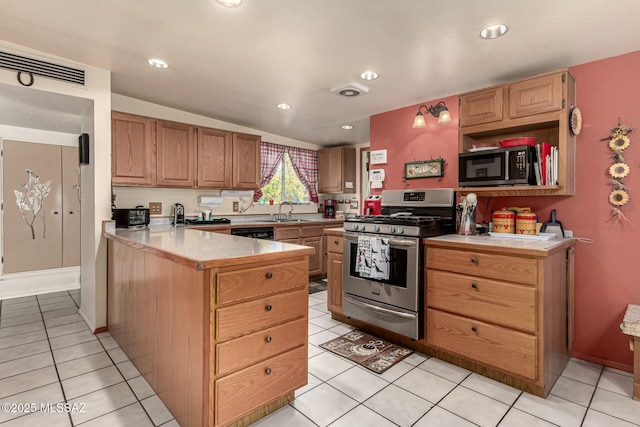 kitchen with sink, light tile patterned floors, stainless steel appliances, and kitchen peninsula