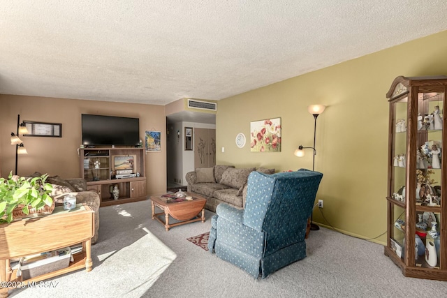 carpeted living room featuring a textured ceiling